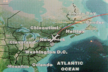 Video screen showing plane's route, with Cleveland labeled.