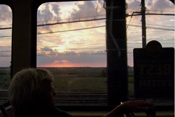 Looking out the train window toward the sunset