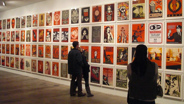 Gallery wall showing many prints by Shepard Fairey