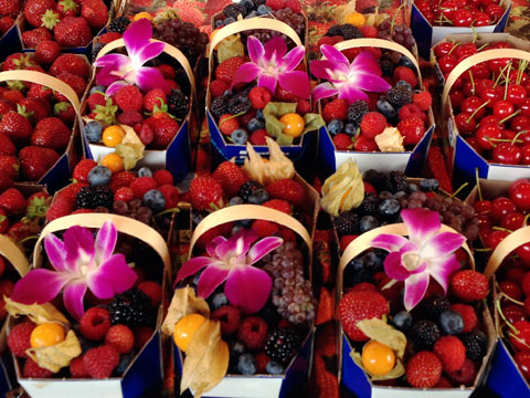 Baskets of colorful berries on display