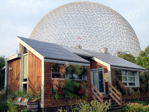 Small 'green' house with dome in background