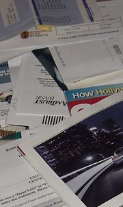 Pile of junk mail on table