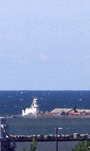 Kelleys Island gravel to Cleveland; lake view - July 2, 2007 Tugboat and barge loaded with gravel
