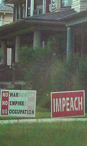 No War and Impeach signs in yard