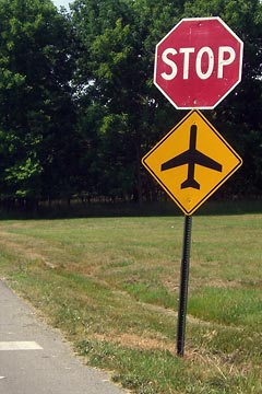 Stop sign plus airplane symbol