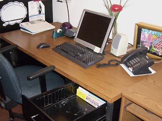 Desk in my school office with top completely clear of junk