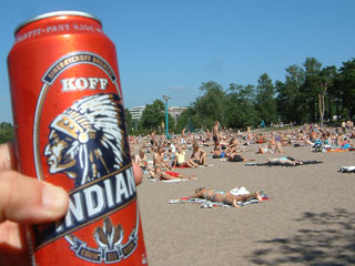 Beach in Helsinki, Finland with bottle of Koff Indian Cord Beer in foreground
