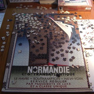 Partly assembled puzzle on table