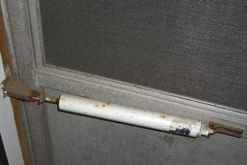 Screen door closer on metal door