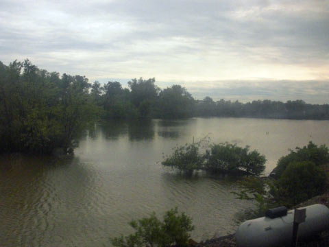 Lots of standing water in fields alongside track