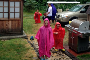 Kids in rain parkas