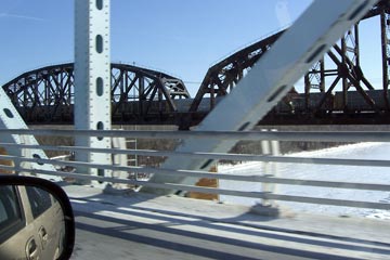 View of a railroad bridge from the highway bridge