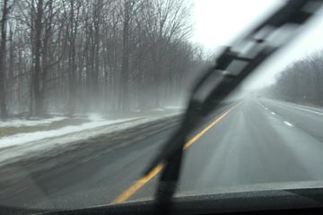 View of snow & mist through the windshield