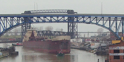 Freighter headed upriver, with two towboats