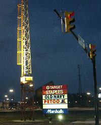 Steel tower with signage in front