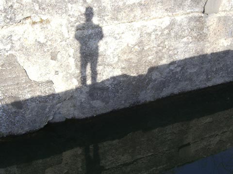 My shadow cast on wall of lock