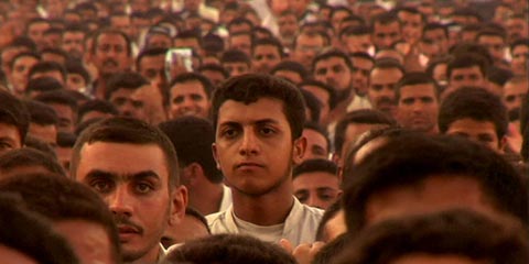 Image of hundred of Islamic militants from film Iraq in Fragments