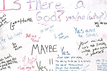 Handwritten responses to question "Is there a God?"