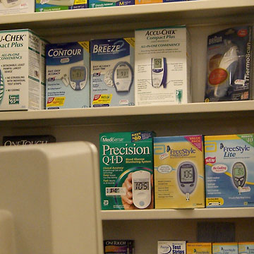 Many boxes of blood-sugar testing products on shelves