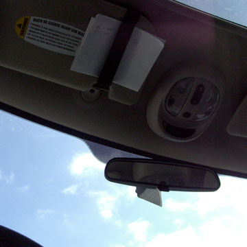 Blue sky seen through car windshield