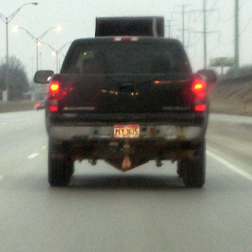 Rear view of pickup truck with pair of balls hanging under the tailgate