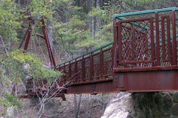 Rusty steel suspension bridge in Hocking Hills park