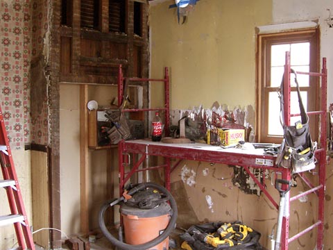 Kitchen interior showing exposed wall framing