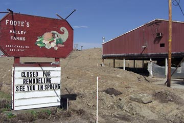 Footes greenhouse surrounded by piles of dirt