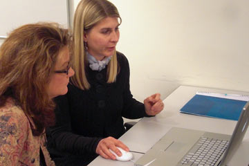 Jen and Maya look at print work