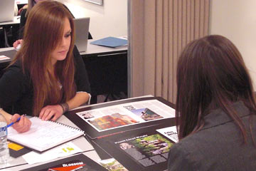 Jen and Maya look at print work