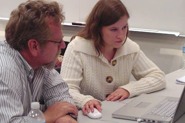 Nadia and John look at website