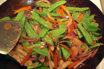 Ginger-scallion pork in wok