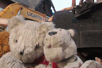 Teddy bears and rubble from boarding house