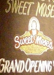 Sign inside of Sweet Moses for Grand Opening
