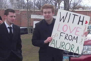 Student from Aurora with sign