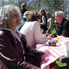 Alice, Chris and others at table.