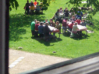 View from the second floor, looking down on table of people eating