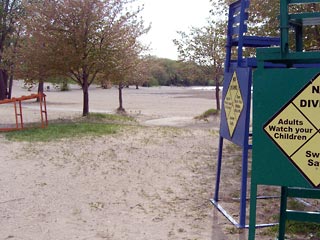 Lifeguard chairs near the beach, waiting to be moved into position