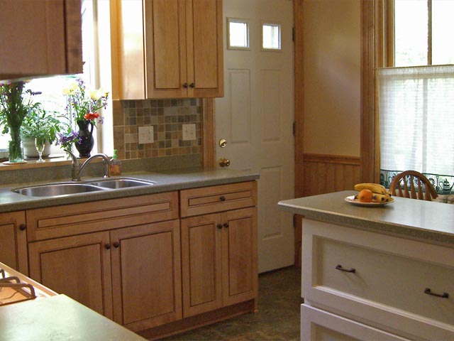 Kitchen with new counters, cabinets and backsplash