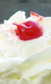 Sundae with whipped cream and cherry