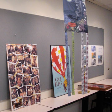 Several student projects lined up against the wall