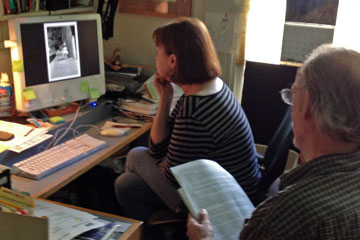 Two people looking at computer