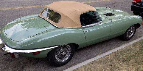 Rear quarter view of green Jaguar XK-E