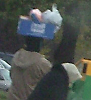 Woman carrying package on her head