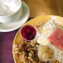 Blintzes on plate, cup of cappuchino