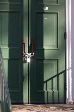 Chain and lock on door handles