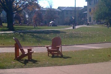 Two Adirondack chairs on CMU campus