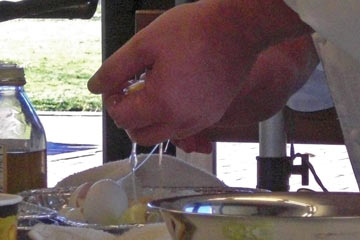 Egg whites dripping through fingers