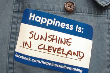 Nametag that says 'Happiness is sunshine in Cleveland'"