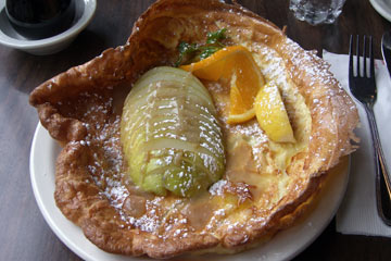 German pancake with crisp edges and sliced pears